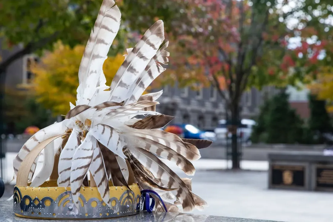 Native American head piece sitting outside.